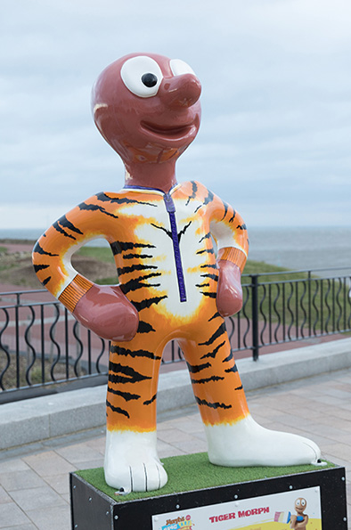 a morph statue painted to make him appear to be wearing a tiger outfit 